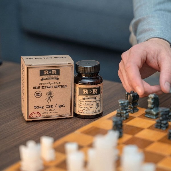 Broad Spectrum CBD Softgels 30mg - 34ct _ R+R Medicinals - Bottle Next To Chess Board