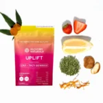 Alchemy Naturals CBD Uplift Gummies for Mood & Workout - Decorative Photo with Ingredients Laid Out Next to Bag