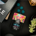 Kush Kube Blast Off THC Gummies - Open Gummy Pouch With Gummies Out On Table