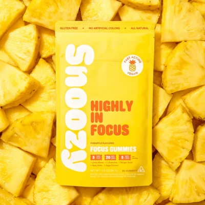 Snoozy Highly in Focus THC Gummies with CBD+CBG - Bag Laid On Pineapples