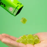 Drops Evergreen Hybrid THC Gummies being Poured Into Hand